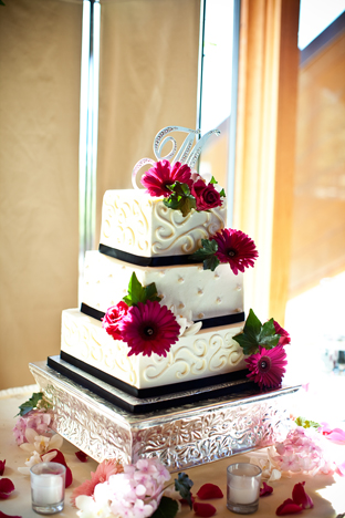 Our cake was decorated with fresh hot pink flowers perfect