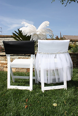 These cute viva glam bride and groom chair covers can be found on Divine 